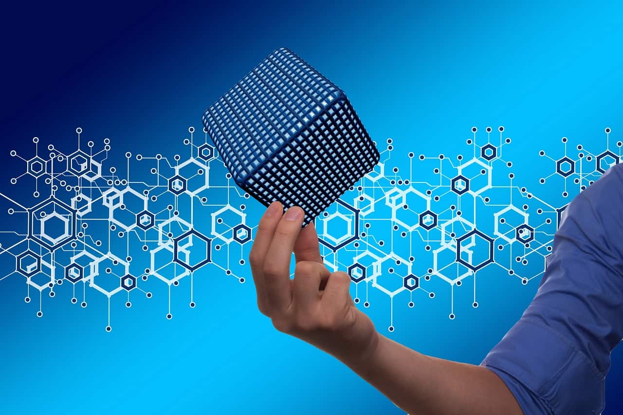 How Real Estate Crowdfunding Can Strengthen and Diversify Your Investment Portfolio - A guy holding a block chain cube